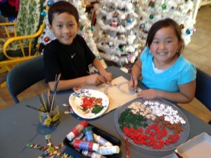 Justin and Cayden get ready to make puzzle piece ornaments
