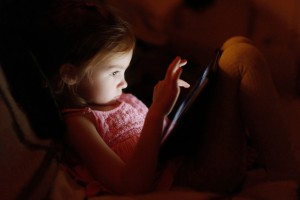 Child and computer game via shutterstock