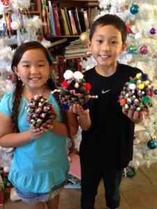 Cayden and Justin and their finished pinecone trees