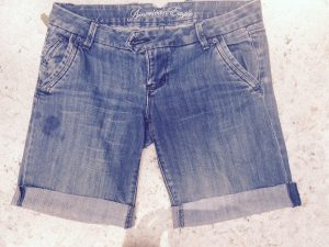 The perfect cut-offs are hard to find, so make your own with thrifted jeans! All you need are scissors, tweezers, and a little know-how.